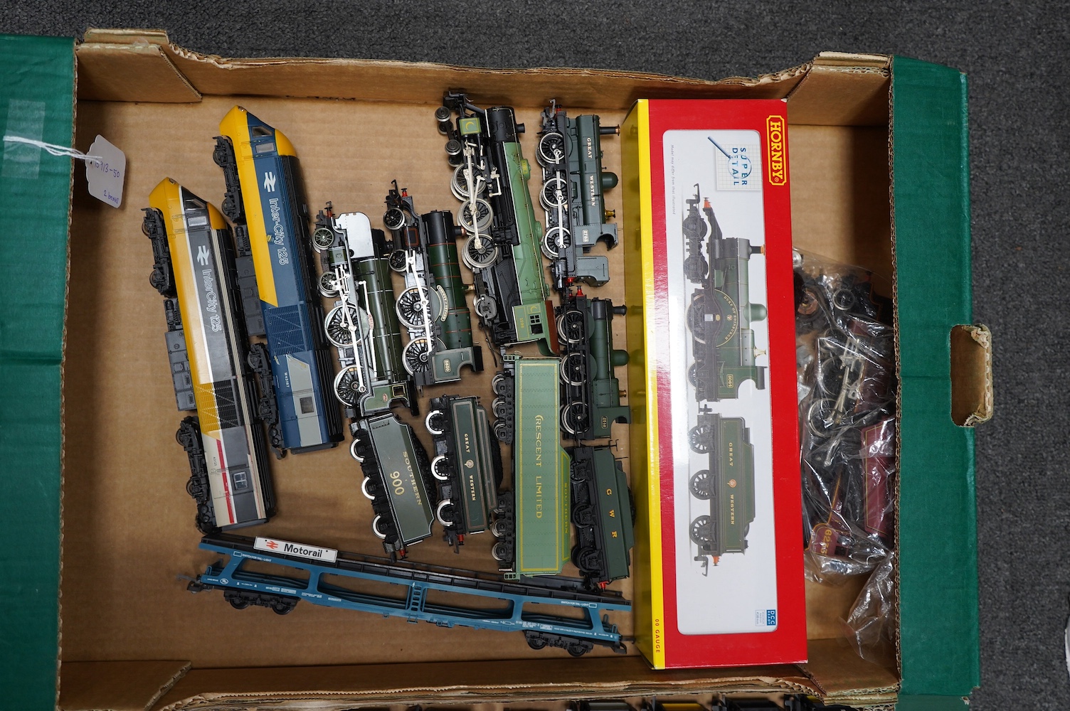 Twenty-two 00 gauge railway by Hornby, Lima, etc. including seven locomotives; a boxed Dean Single 4-2-2 tender loco (R2828), three GWR locos including a County Class, a Southern Railway Schools Class loco, together with